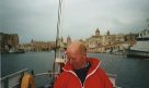 Helen takes the camera while John surveys the port